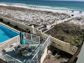 A pool area with a view of the beach and ocean. - AV33 - Lovely Oceanfront 2-Bedroom Condo with Pool (Fort Walton Beach)