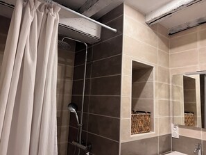 Shower, hair dryer, towels, toilet paper