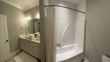 Combined shower/bathtub, hair dryer, towels, soap