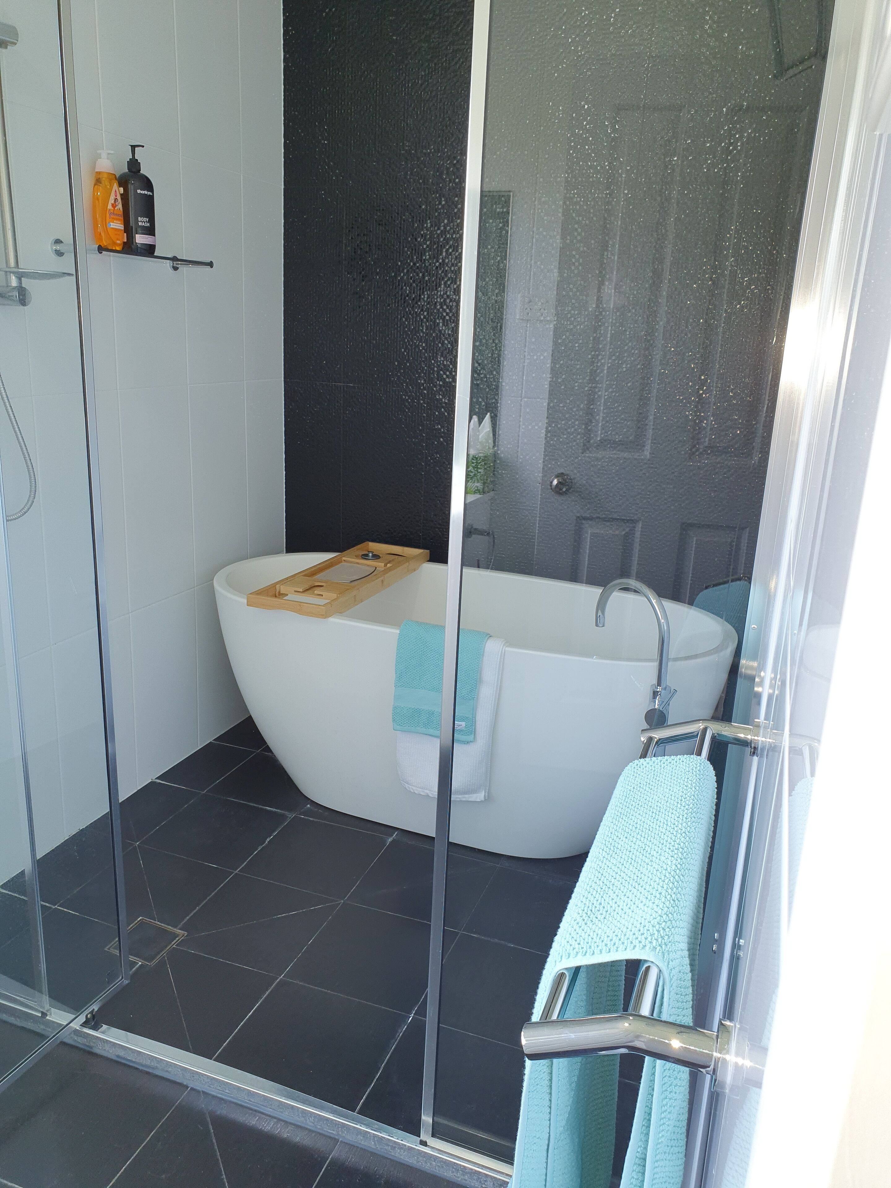 Bathtub, hair dryer, towels, soap