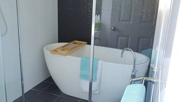 Bathtub, hair dryer, towels, soap