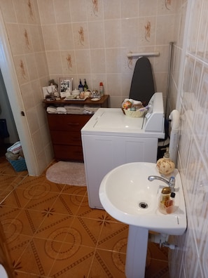 Shower, towels, soap, toilet paper