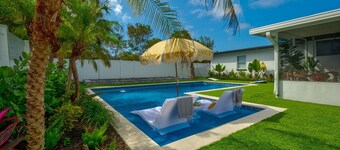 Retro Beach Escape | Heated Pool + Screened Patio