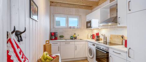 Fridge, stovetop, dishwasher, coffee/tea maker