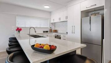 Coffee/tea maker, fridge, microwave, oven