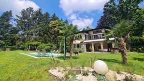 A house with a swimming pool, surrounded by a well-maintained lawn and various trees. - Wonderful Villa Between Como And Milano (Sirtori)