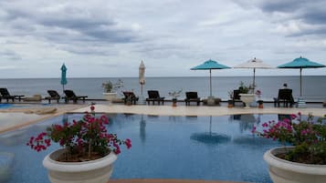 8 outdoor pools, open 7:00 AM to 8:00 PM, pool umbrellas, sun loungers