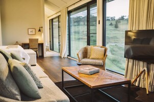 Luxury Pavilion | Living area | Flat-screen TV, fireplace