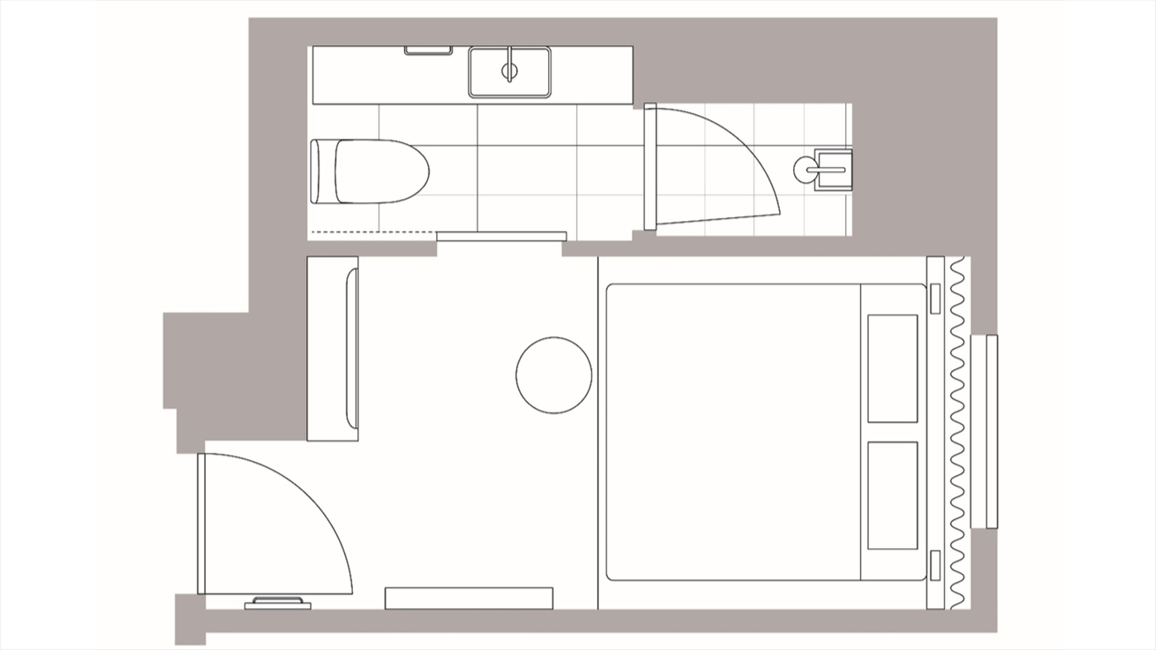 Plano de un cuarto de hotel que incluye una cama, baño, kitchenette y un espacio para sentarse.