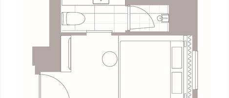 Plano de un cuarto de hotel que incluye una cama, baño, kitchenette y un espacio para sentarse.