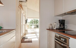 Fridge, stovetop, dishwasher, coffee/tea maker