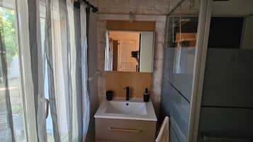 Shower, towels, soap, toilet paper