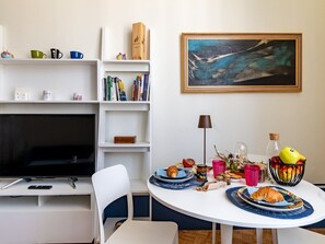 Senior Studio | Living area | 24-inch flat-screen TV with digital channels, TV