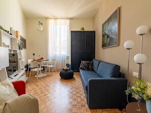 Senior Studio | Living area | 24-inch flat-screen TV with digital channels, TV