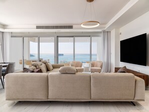 Luxury Apartment, 3 Bedrooms (9F) | Living area | 65-inch LED TV with satellite channels, TV - The Tower at St Raphael Resort (Limassol)