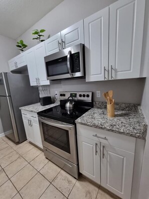 Fridge, microwave, oven, stovetop - CasaComfort near Disney-King Suite bedroom, FREE Amenities, and great location. (Kissimmee)