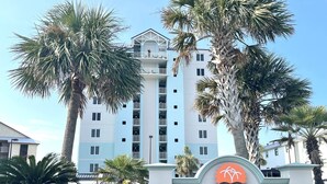 A multi-story building with a sign reading "TROPIC ISLES 433".
