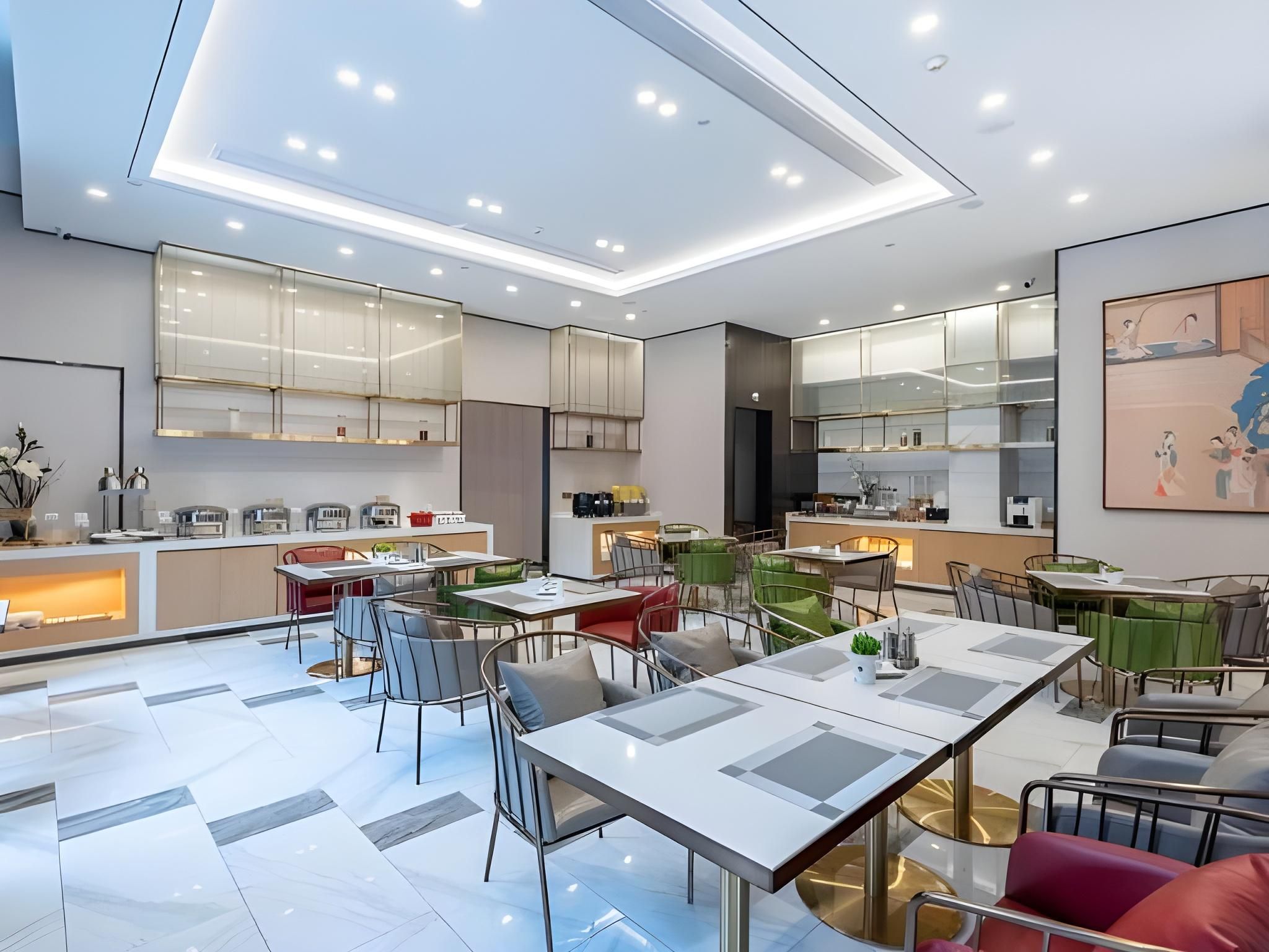 A modern interior with a dining area, kitchen, and bar/lounge space.