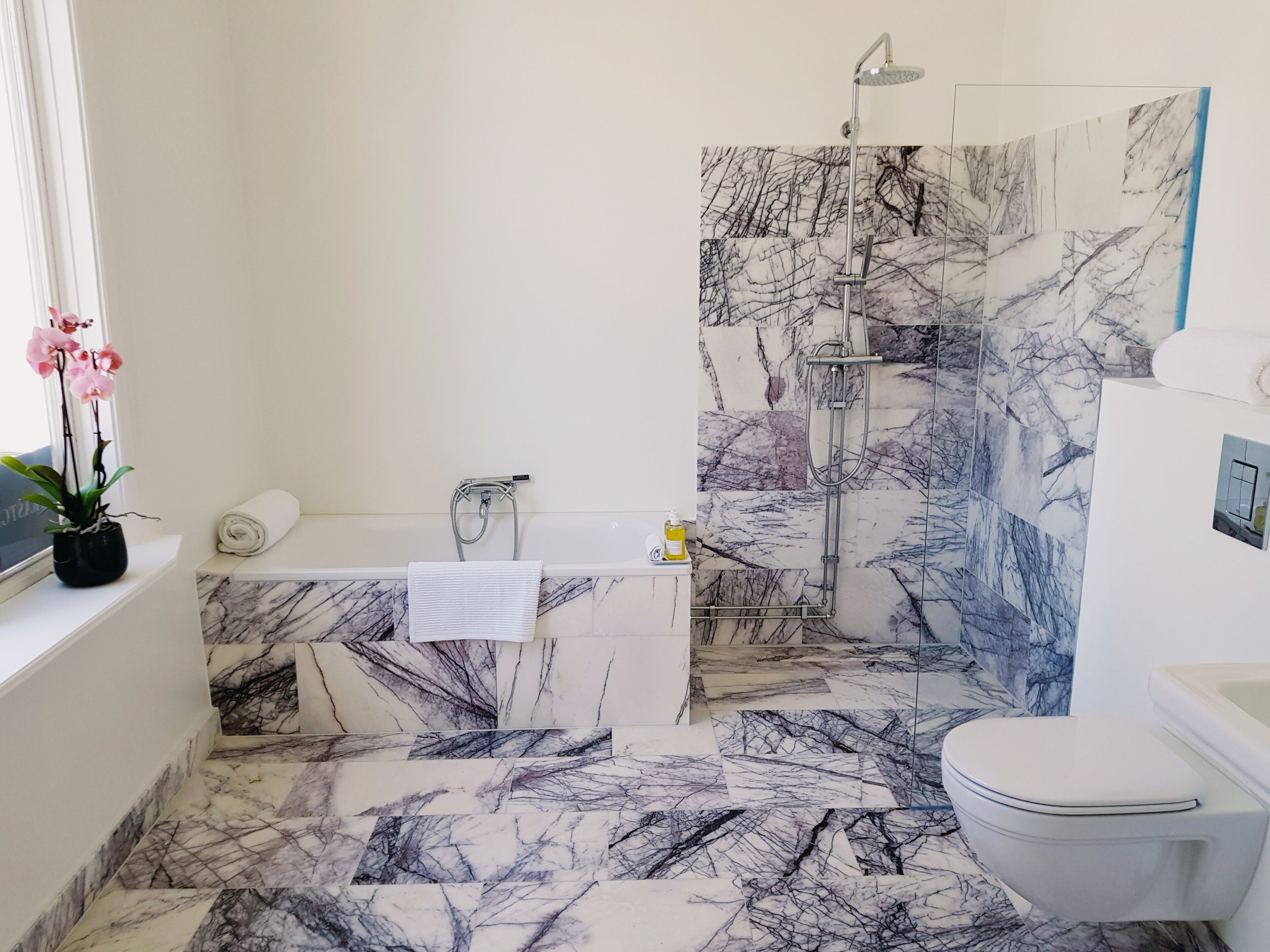 deluxe suite | bathroom | designer toiletries, hair dryer, heated floors, towels