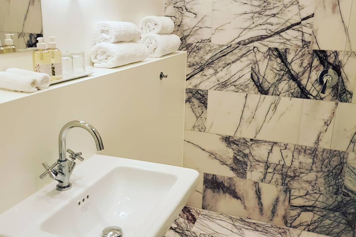 designer toiletries, hair dryer, heated floors, towels