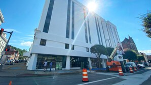 A modern building with large windows and a flat facade. - The McLure Hotel and Conference Center (Wheeling)