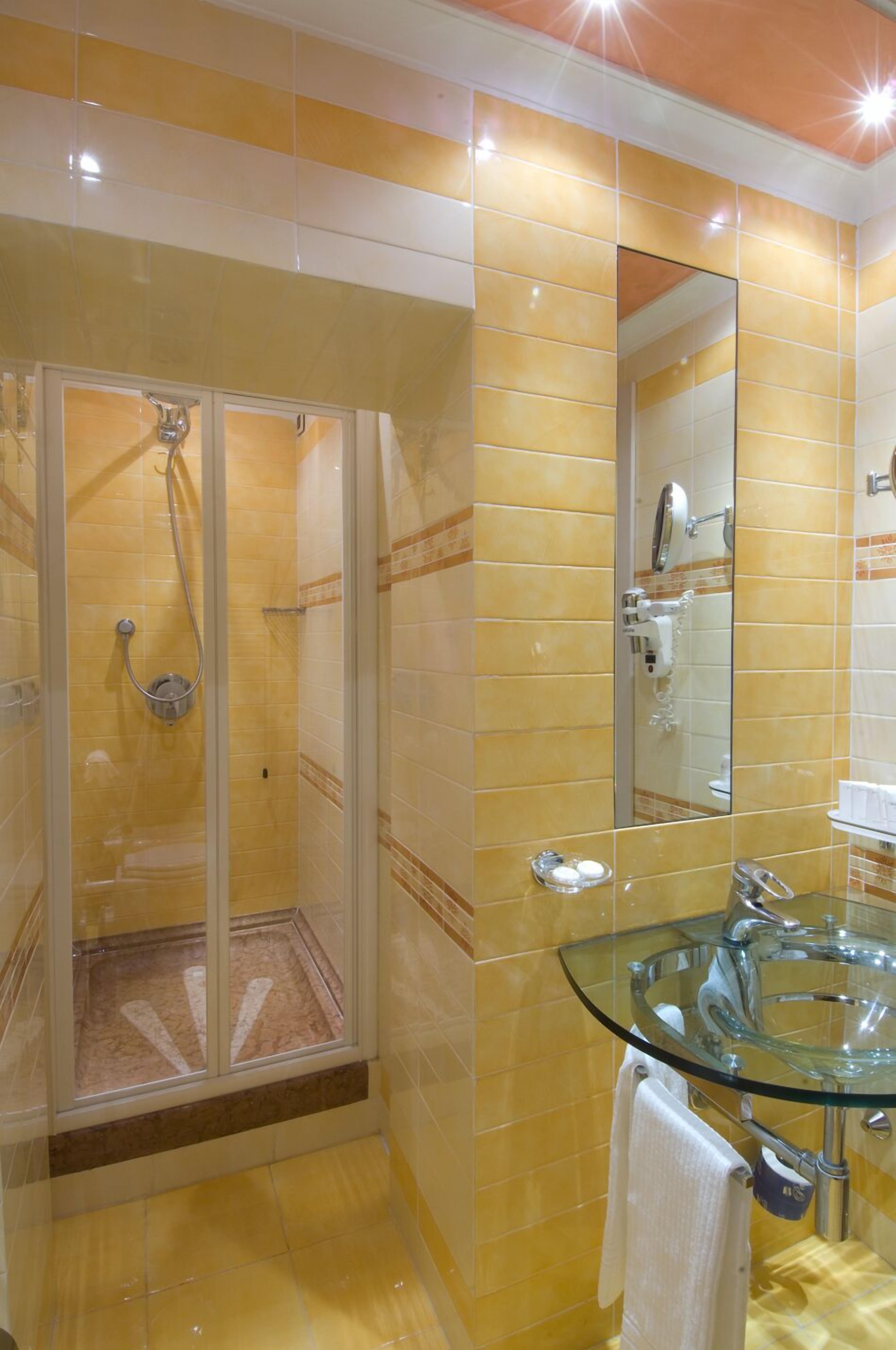 superior double room | bathroom | shower, rainfall showerhead, free toiletries, hair dryer