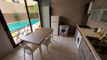 Fridge, microwave, oven, dining tables