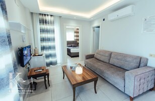 Deluxe Suite Land View with Balcony | 1 bedroom, desk, laptop workspace, iron/ironing board