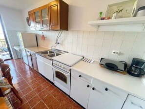 Fridge, stovetop, coffee/tea maker, toaster