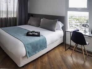 Premium bedding, down comforters, memory foam beds, in-room safe