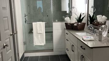Combined shower/tub, hair dryer, towels, soap