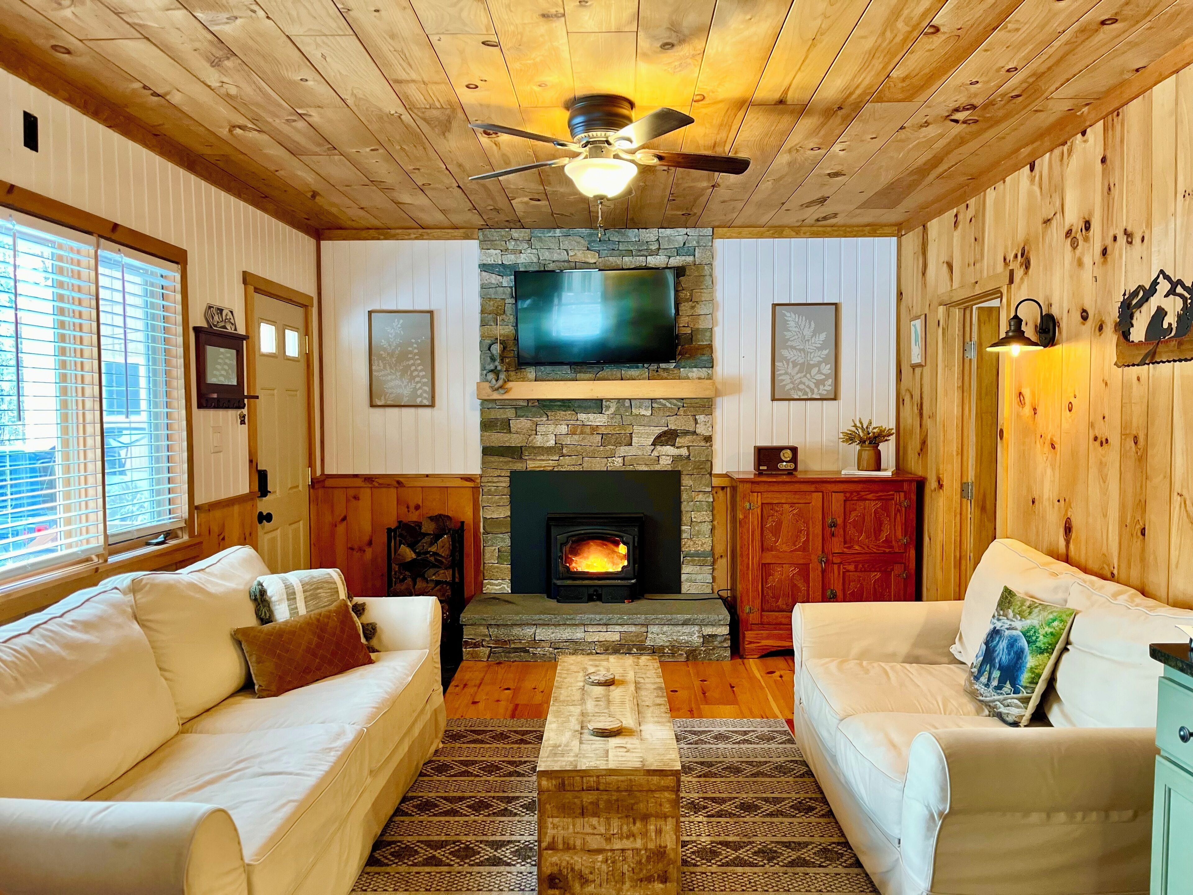 Stone fireplace, moody lighting & all the right touches.