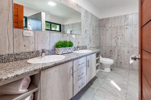 Ultramodern Townhome with an Inviting Coastal Design and Lush Outdoor Oasis with a Private Pool
