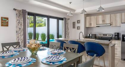 Ultramodern Townhome with an Inviting Coastal Design and Lush Outdoor Oasis with a Private Pool