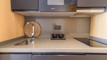 Fridge, microwave, stovetop, coffee/tea maker