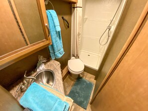 Shower, hair dryer, towels, soap