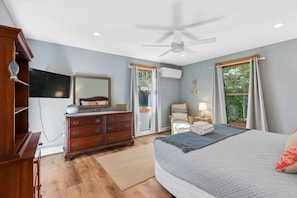 A bedroom with a bed, dresser, ceiling fan, and a window with curtains. - Walk to Downtown OGT! (Ogunquit)