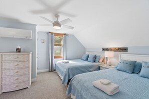 A bedroom with two beds, a ceiling fan, a dresser, and a window with curtains. - Walk to Downtown OGT! (Ogunquit)