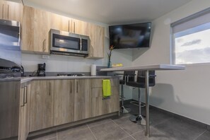 Fridge, microwave, stovetop, coffee/tea maker