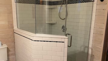Shower, towels, soap, toilet paper