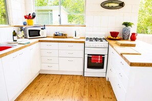 Fridge, microwave, toaster, cookware/dishes/utensils