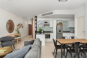 Classic Apartment | Living area | 32-inch flat-screen TV with cable channels, TV, Netflix