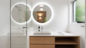 Combined shower/bathtub, towels, toilet paper