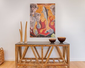 A wooden console table with two bowls and two sticks. - Sunshine Beach House - Beautiful parts of nature (Sunshine Beach)