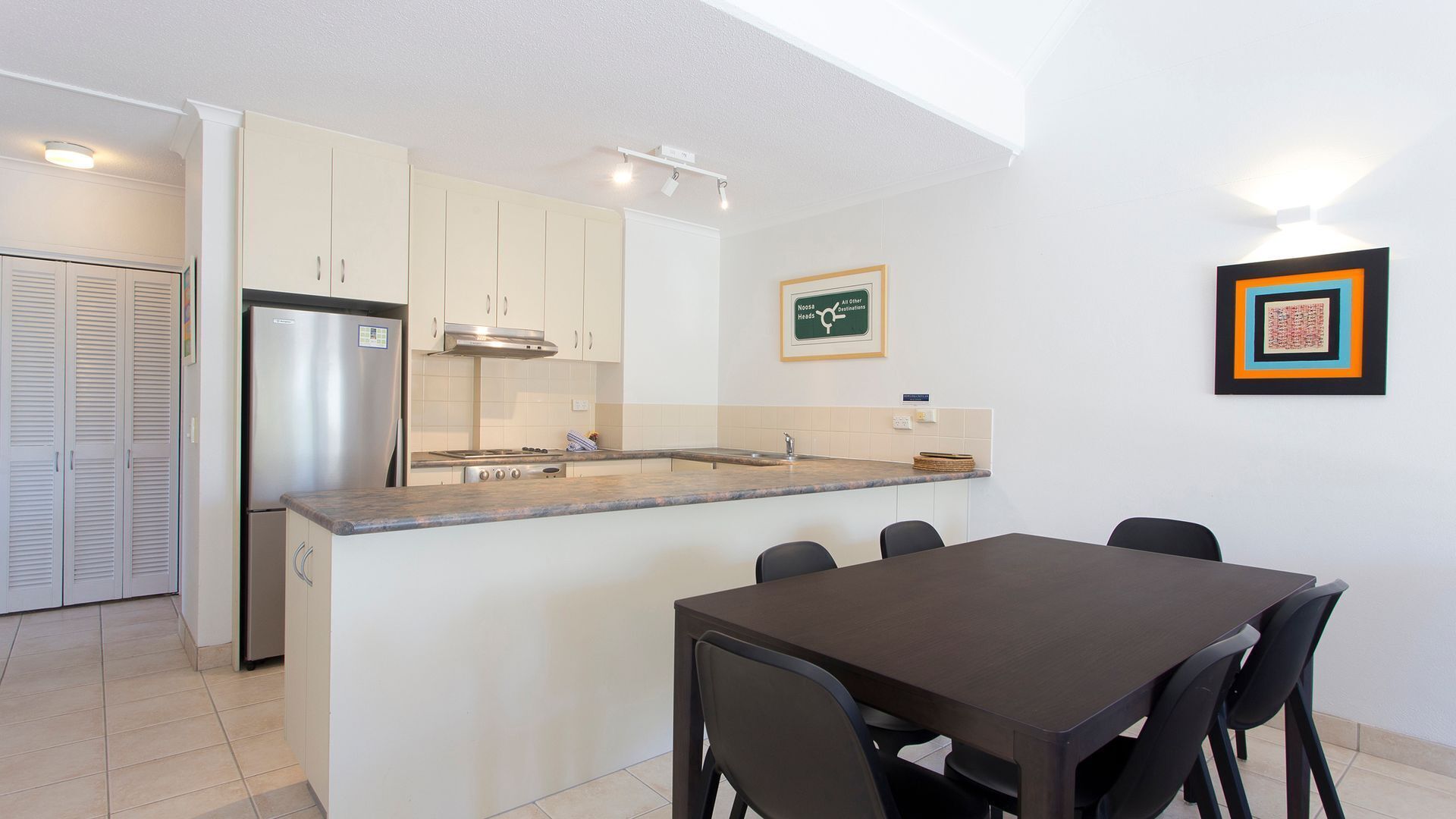 Relax by the pool whilst enjoying the landscaped garden and Laguna Bay views — image 6
