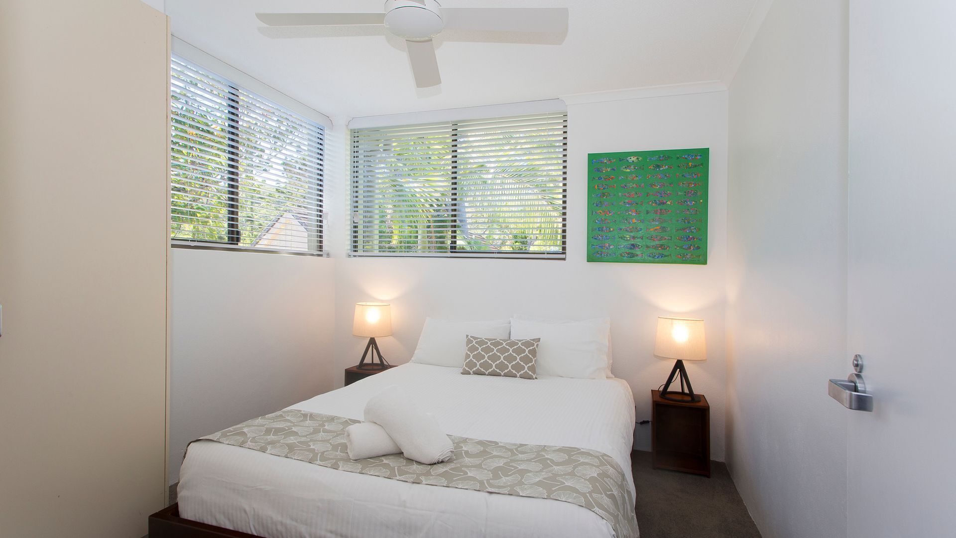 Relax by the pool whilst enjoying the landscaped garden and Laguna Bay views — image 10