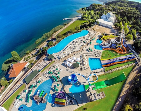 Indoor pool, seasonal outdoor pool, pool umbrellas, pool loungers. Hotel Izgrev Spa & Aqua Park