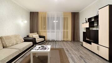 Family Apartment | Living area | 40-inch flat-screen TV with cable channels, TV