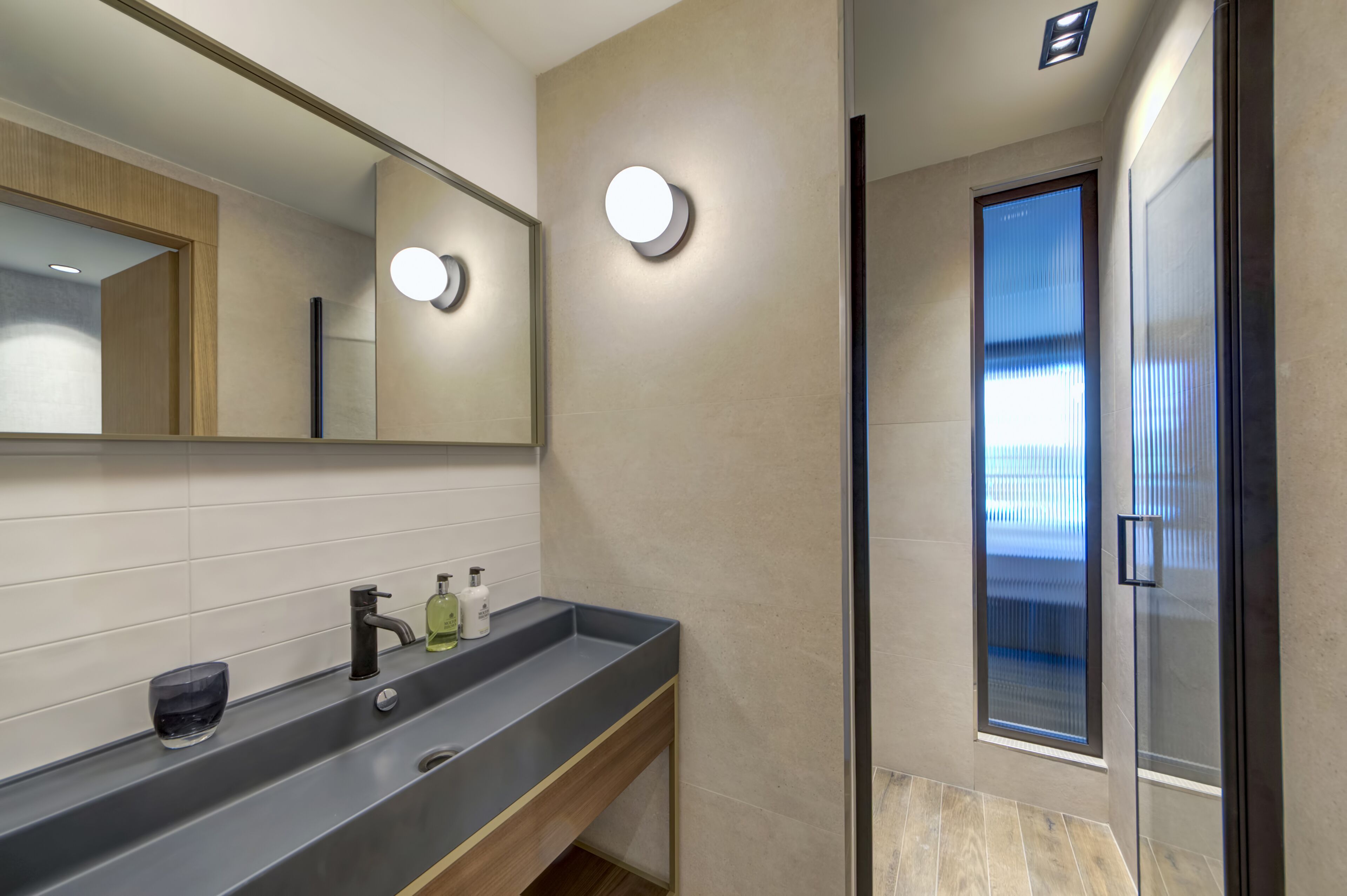 designer toiletries, hair dryer, bathrobes, slippers