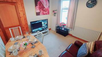 House | Living room | 30-inch TV with cable channels